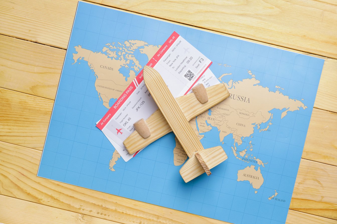 Set of Travel Items on Wooden Background